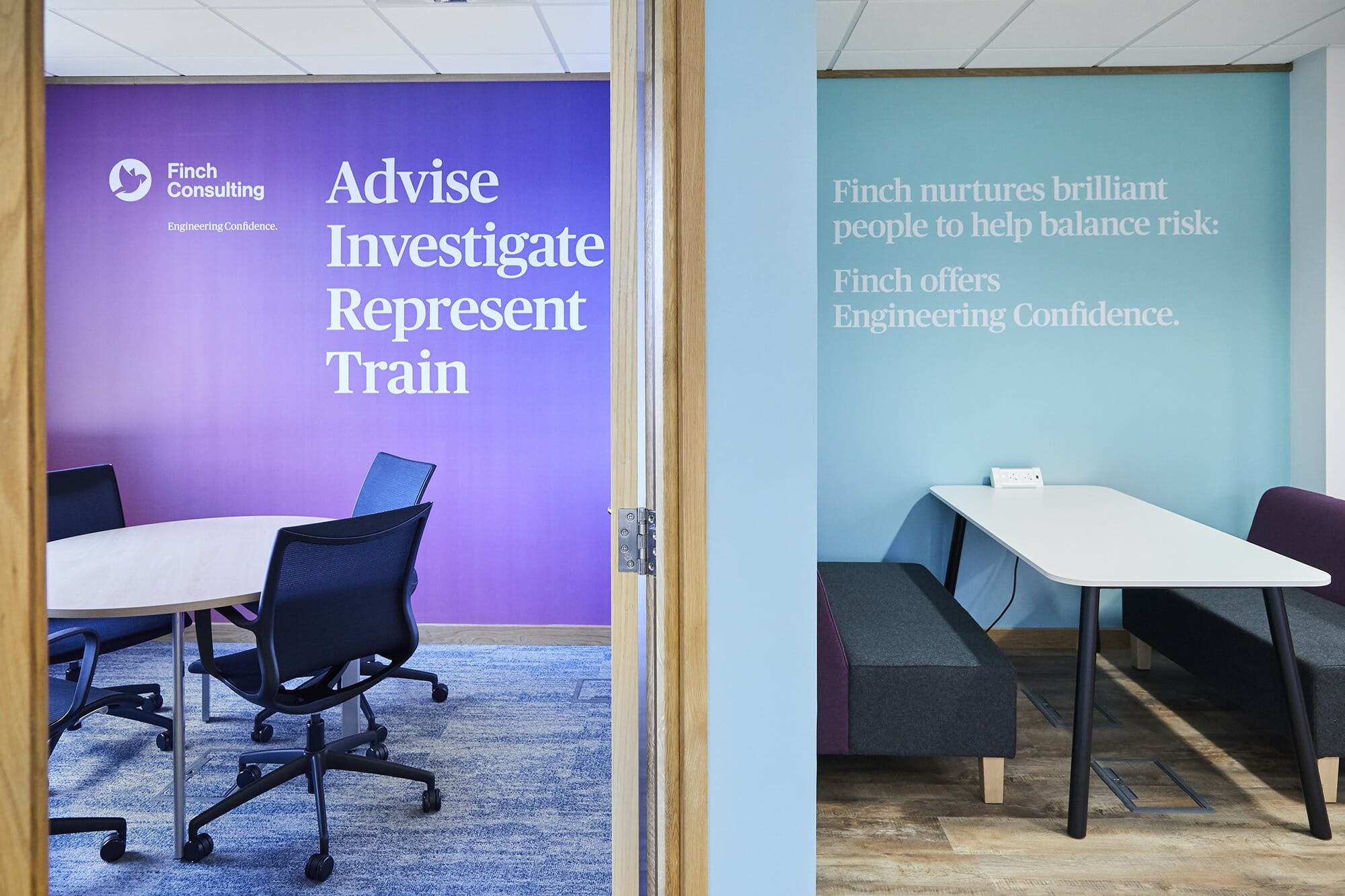 Finch Consulting commercial office design featuring company-branded wall graphics